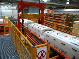 Systém pro přepravu balíků skelné vaty